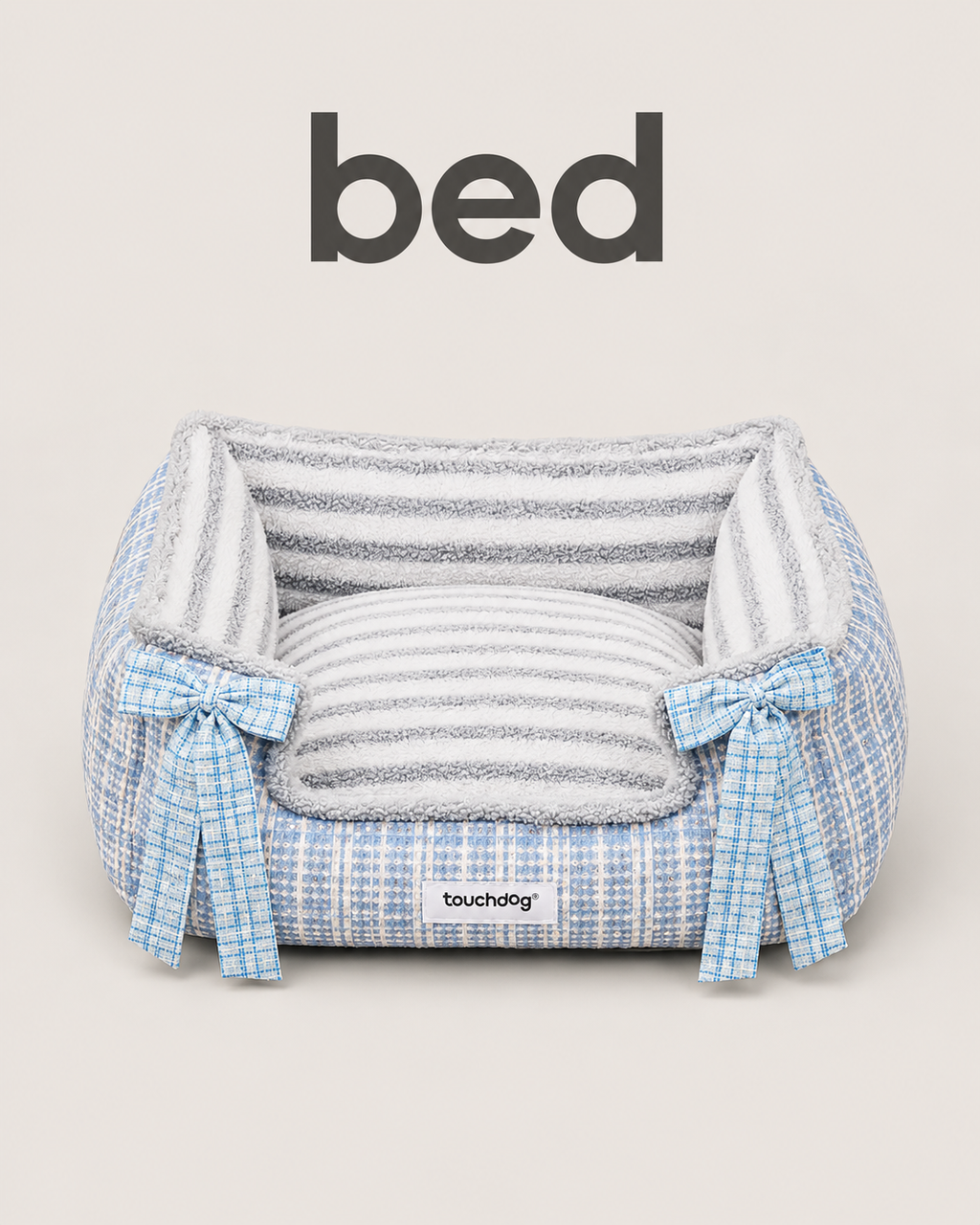 Blue tweed pet bed with plush striped interior and blue plaid bow accents