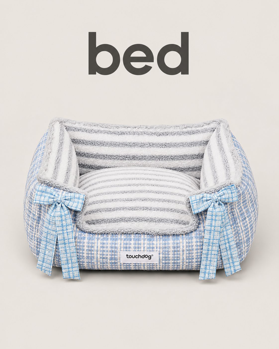 Blue tweed pet bed with plush striped interior and blue plaid bow accents