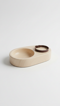 Sandstone pet bed with sculpted edges